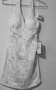 White sequin halter dress with sheer cutouts